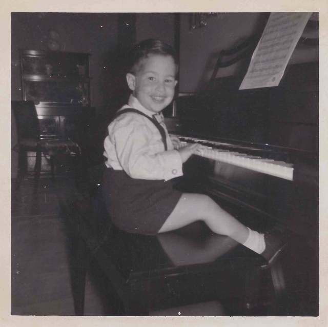 John at the piano, a few years before beginning lessons.